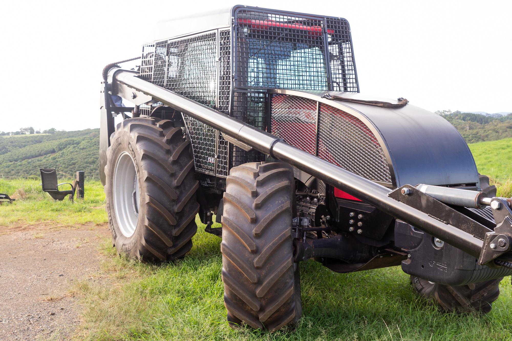 tractor with pruning attachment and metal shielding